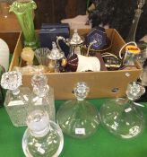 Two clear glass ship's decanters, a clear glass decanter, two square moulded glass decanters,