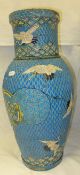 A large Japanese satsuma vase decorated with cranes on a patterned blue ground, bears character