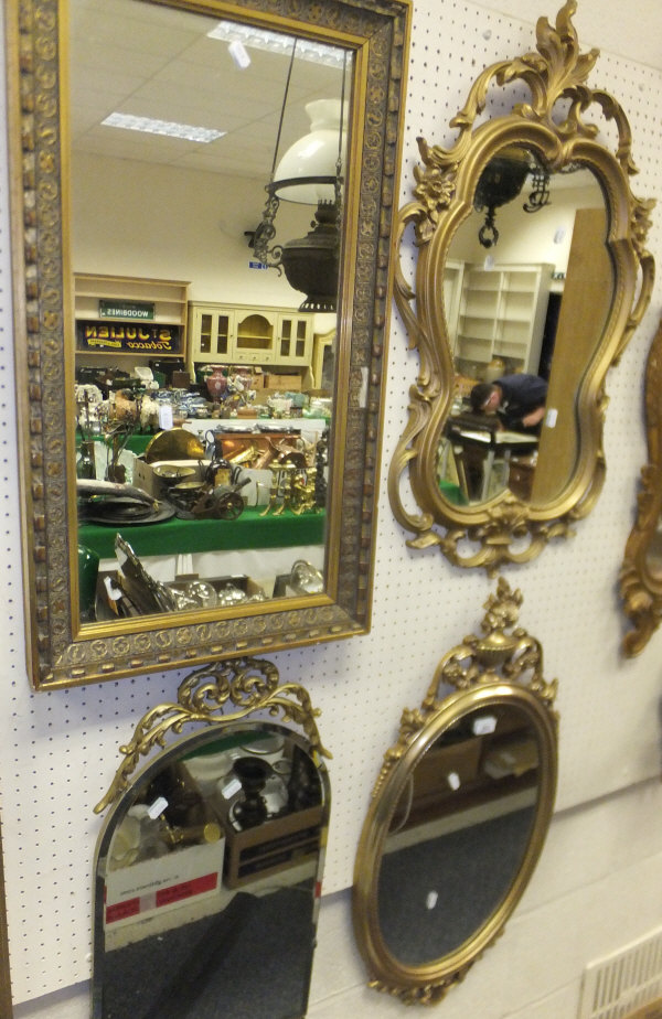 Four various gilt framed wall mirrors