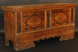An 18th Century pine coffer, the top with two plain panels over two marquetry inlaid panelled