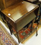 A Victorian mahogany drop leaf work table with two drawers opposite two dummy drawers on ringed