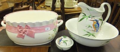 A Victorian Minton foot bath with pink ribbon and floral spray decoration on a white ground,