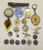 A box containing various medallions, badges, etc. to include a Spode brooch, various farthings,