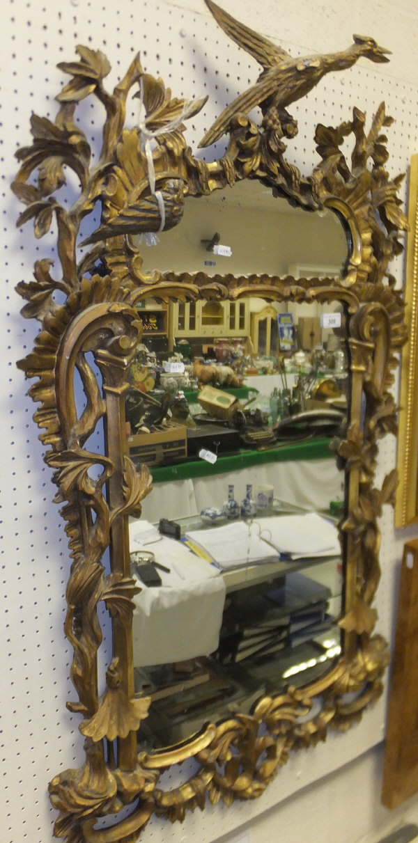 A 19th century carved giltwood and gesso framed wall mirror in the rococo manner   CONDITION REPORTS