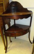 A 19th century mahogany corner wash stand with central drawer flanked by two dummy drawers on square