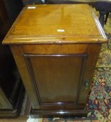 A 19th century mahogany cabinet, the plain top with moulded edge above a single panelled door