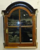 A 19th century Dutch walnut cabinet, the domed top with moulded cornice above a single glazed and