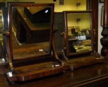 A Victorian mahogany toilet mirror, the plain rectangular plate on S-scroll supports to platform