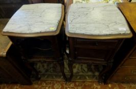 A matched pair of French rosewood bedside cupboards in the Louis XV taste