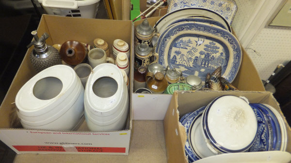 Three boxes of assorted china wares to include Wade spirit flagons, blue and white meat platters,