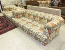 A modern Chesterfield style three seat scroll arm settee with kelim style printed fabric, together
