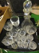 A glass decanter with facet cut sides, another glass decanter, together with assorted glass drinking