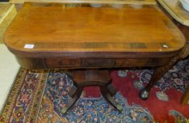 A Regency mahogany and rosewood cross-banded card table, the D shaped fold-over top revealing a