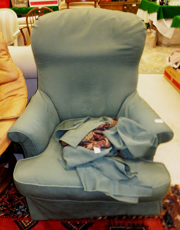 A modern Laura Ashley upholstered armchair with loose covers