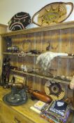 Assorted tribal items to include a hide shield, spear head, carved African figures and animals,