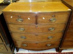 A Victorian mahogany bow fronted chest of two short and three long drawers on bracket feet