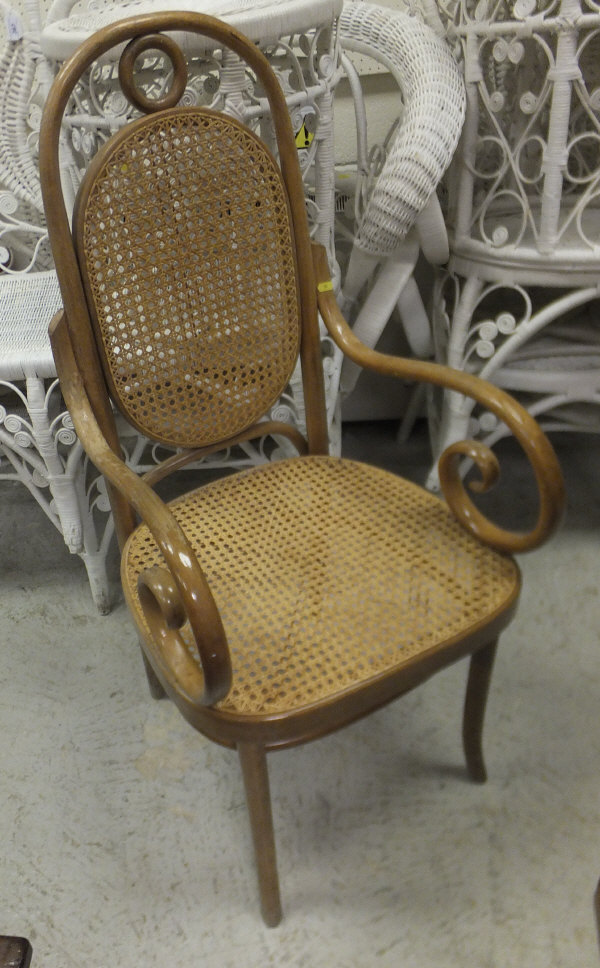 A set of eight bentwood and cane seated dining chairs