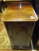 A Victorian mahogany pot cupboard with single door on a plinth base