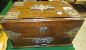 An oak cigar box with brass mounts and fitted interior   CONDITION REPORTS  brass fitting has