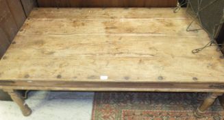 A rectangular wood Ethnic style coffee table with metal banding
