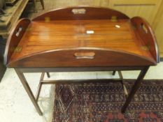 A circa 1900 mahogany oval butlers tray on a later stand   CONDITION REPORTS  Has some general