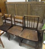 A mid 20th Century oak settle with upholstered seat, a pair of 19th Century Provincial dining chairs