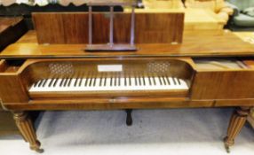 A John Broadwood & Sons mahogany square piano of typical outline, the hinged top revealing a