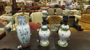 A Oriental porcelain table lamps
 decorated with bamboo, together with a pair of baluster shaped