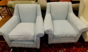 A pair of modern upholstered armchairs