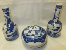 A pair of Chinese porcelain bottle shaped vases decorated in underglaze blue with dragon and cloud