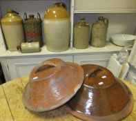 A collection of stoneware jars to include inscribed examples "E & WG Woodward Spirit Merchants