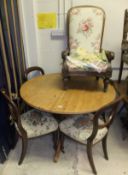 An early 20th century oak framed salon chair upholstered in green floral fabric, set of three