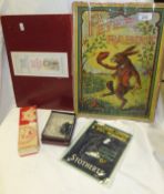 Circa 1910 and circa 1945 Peter Rabbit board games, together with a 1950's Coca Cola thermometer,