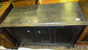 A circa 1700 oak coffer, the plain top above three plain panels to square moulded stile supports