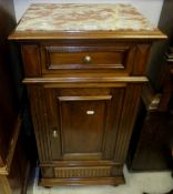 A Continental marble top walnut pot cupboard with single drawer over panelled door to turned feet