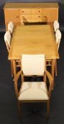 A Gordon Russell of Broadway dining room suite, comprising six chairs, draw leaf table and
