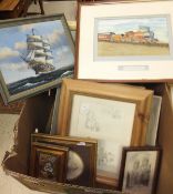 A box of various paintings and prints