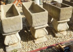 Three various reconstituted stone rectangular troughs on stands