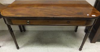 A Victorian mahogany serving table, the plain top with beaded edge above a single drawer fitted