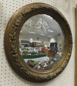 A 19th Century style giltwood and gesso floral decorated convex mirror
