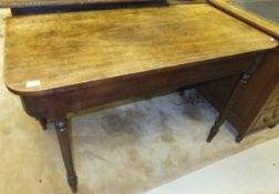 A 19th Century mahogany single drop-leaf dining table on turned legs