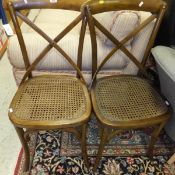 A pair of OKA cane seated bentwood dining chairs