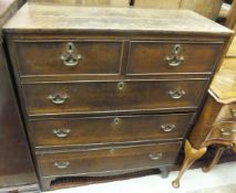 A 19th Century oak chest of two short and three long graduated drawers