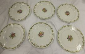 A set of six Continental porcelain plates painted with floral sprays, inscribed to bases "Rousseau