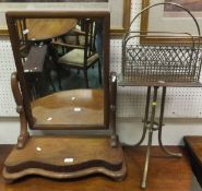 A late Victorian brass and oak revolving magazine rack and a mahogany dressing mirror