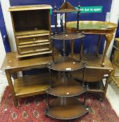 A yew wood kidney shaped coffee table, a four tier corner whatnot, two oak two tier trolleys, and an