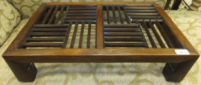 An early 20th Century Chinese padouk wood tea table with lattice work top on scroll feet   CONDITION