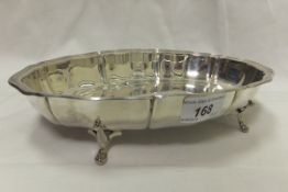 A George VI silver oval shaped bowl with pie crust rim raised on four feet (Sheffield, 1939)