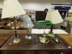 A collection of four various table lamps to include a brass desk lamp with green glass shade