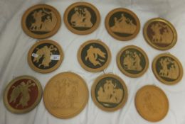 A collection of twelve Copenhagen terracotta circular plaques, relief moulded with Classical